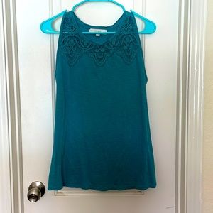 Teal colored sleeveless top